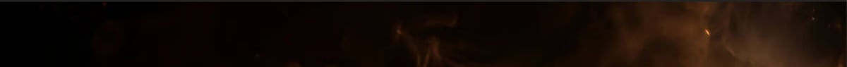 Dark abstract image with warm brown and gold tones, possibly a blurred or out-of-focus background or texture